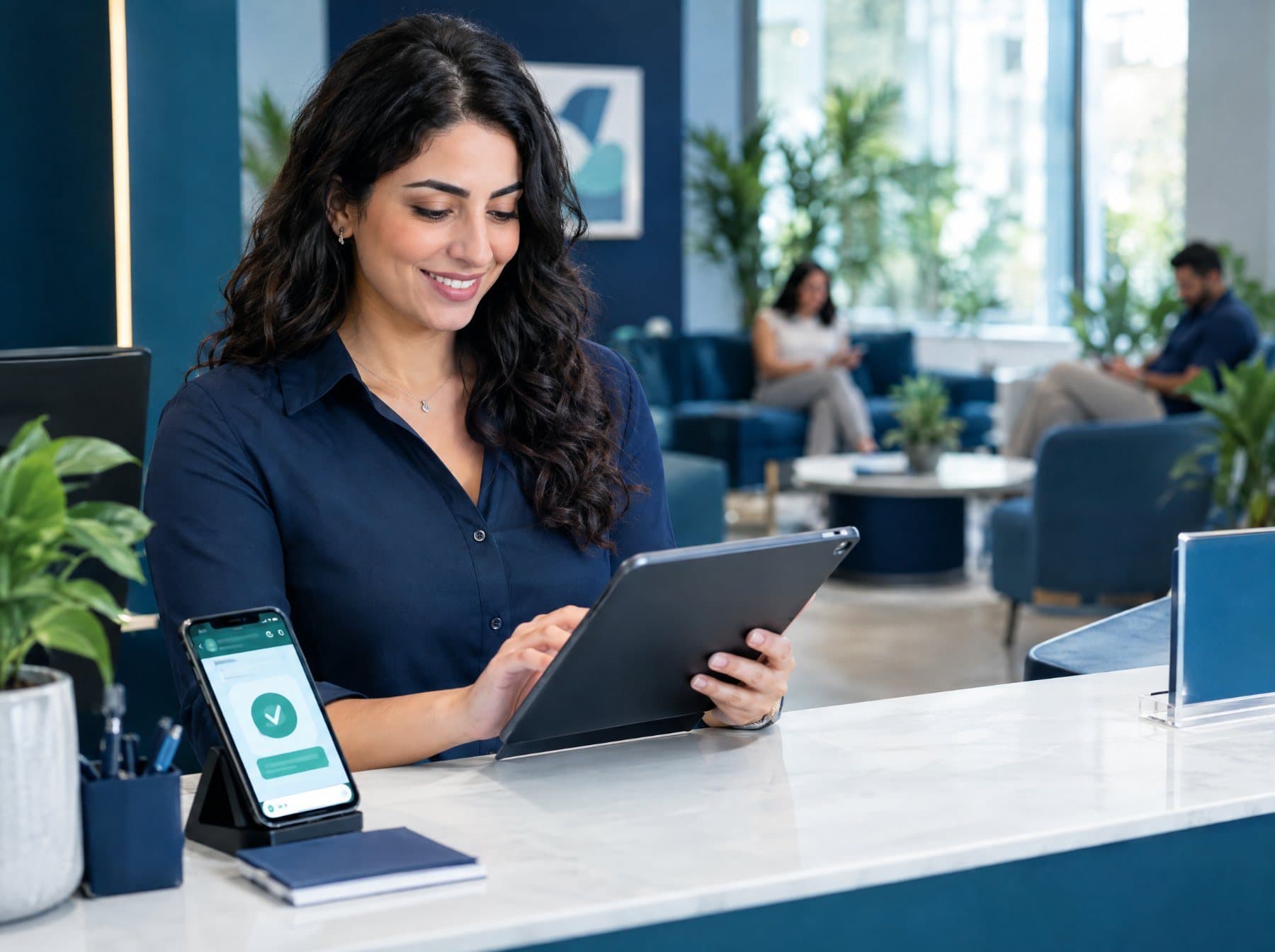 A receptionist confirming an appointment on a tablet